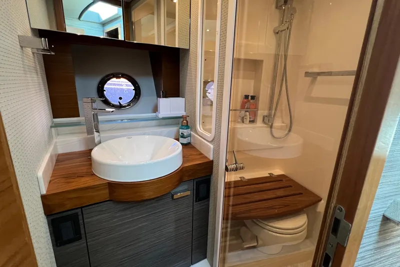 Lady Linn Yacht Photos Pics 2020 Tiara Yachts C44 Coupe bathroom with modern sink and shower.
