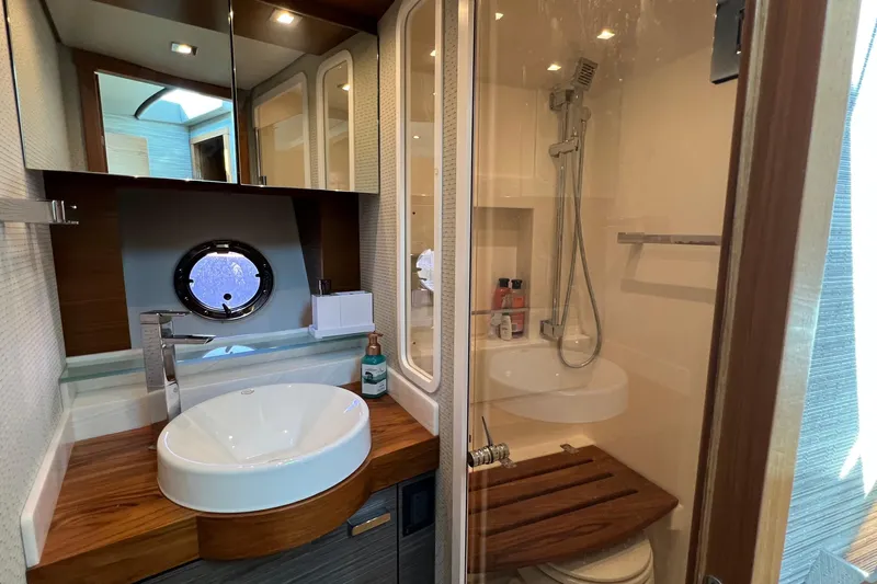 Lady Linn Yacht Photos Pics Luxurious bathroom in 2020 Tiara Yachts C44 Coupe with modern fixtures and shower.