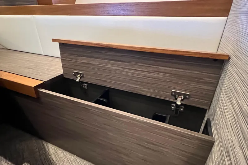 Lady Linn Yacht Photos Pics 2020 Tiara Yachts C44 Coupe interior storage compartment with wood finish.