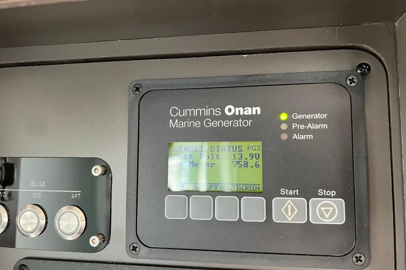 Lady Linn Yacht Photos Pics Control panel of Cummins Onan marine generator on 2020 Tiara Yachts C44 Coupe.