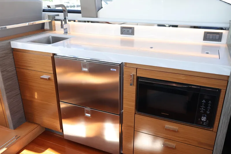 Lady Linn Yacht Photos Pics Modern kitchen area in 2020 Tiara Yachts C44 Coupe with stainless steel appliances.