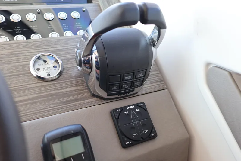 Lady Linn Yacht Photos Pics Control panel of 2020 Tiara Yachts C44 Coupe with throttle and trim tabs.