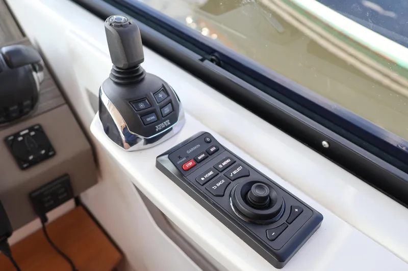 Lady Linn Yacht Photos Pics Control panel of 2020 Tiara Yachts C44 Coupe with joystick and navigation controls.