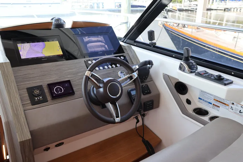Lady Linn Yacht Photos Pics 2020 Tiara Yachts C44 Coupe helm with advanced navigation displays and controls.