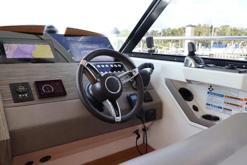 Lady Linn Yacht Photos Pics 2020 Tiara Yachts C44 Coupe helm with advanced navigation displays and controls.