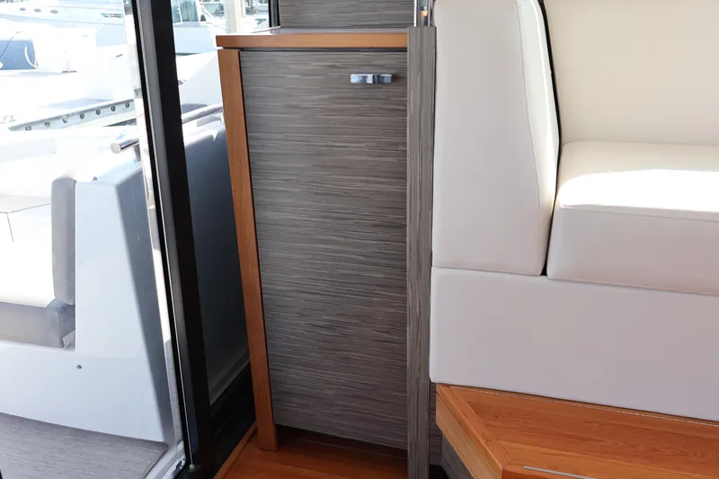 Lady Linn Yacht Photos Pics Interior of 2020 Tiara Yachts C44 Coupe, featuring sleek wood and leather design elements.