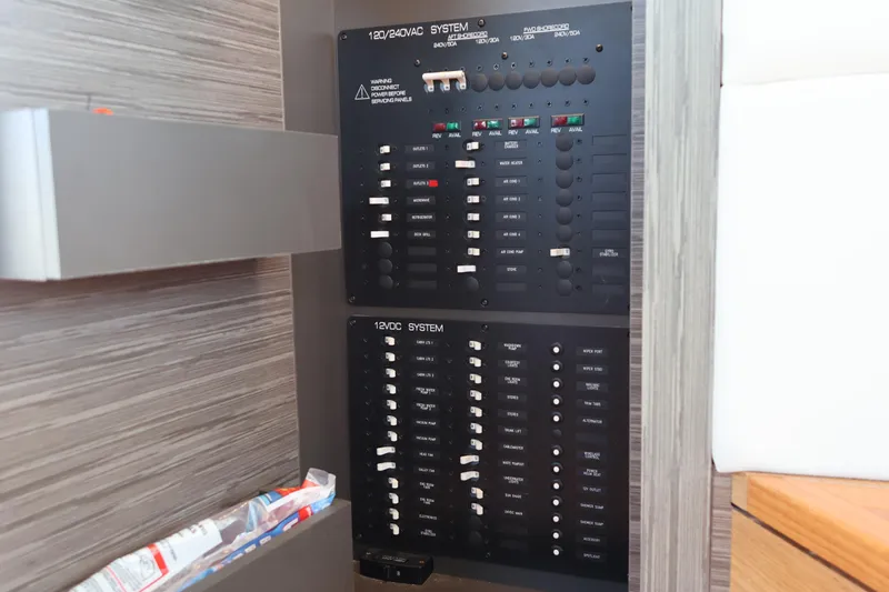 Lady Linn Yacht Photos Pics Electrical panel on 2020 Tiara Yachts C44 Coupe, showcasing 120/240VAC and 12VDC systems.