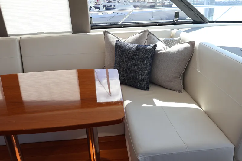 Lady Linn Yacht Photos Pics Luxurious interior of 2020 Tiara Yachts C44 Coupe with elegant seating and cushions.