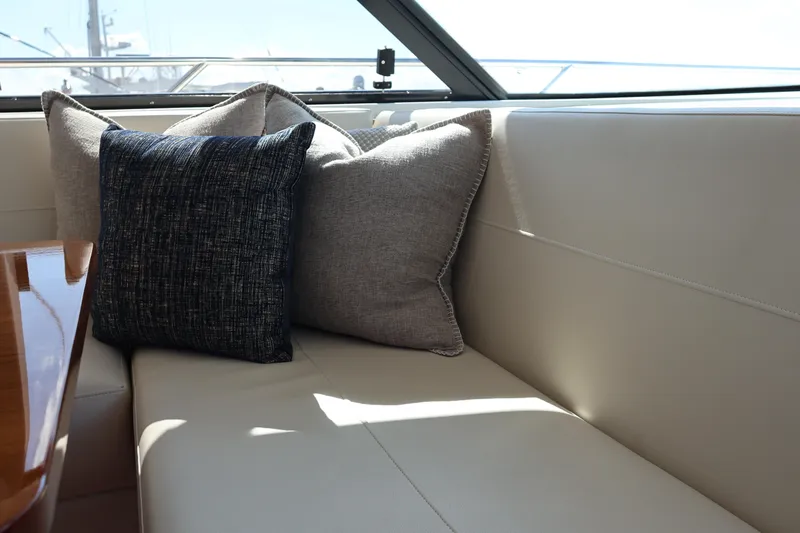 Lady Linn Yacht Photos Pics Luxurious interior seating with cushions on 2020 Tiara Yachts C44 Coupe.