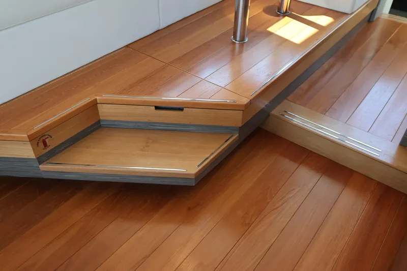 Lady Linn Yacht Photos Pics 2020 Tiara Yachts C44 Coupe interior with elegant wooden flooring and steps.