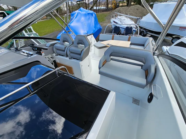  Yacht Photos Pics 2024 Beneteau Flyer 10 boat interior with modern seating and sleek design.