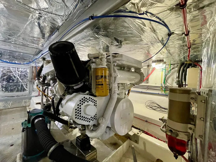 What A Life Yacht Photos Pics Engine room of 2003 Ocean Alexander 510 Classico yacht, showcasing mechanical components and wiring.