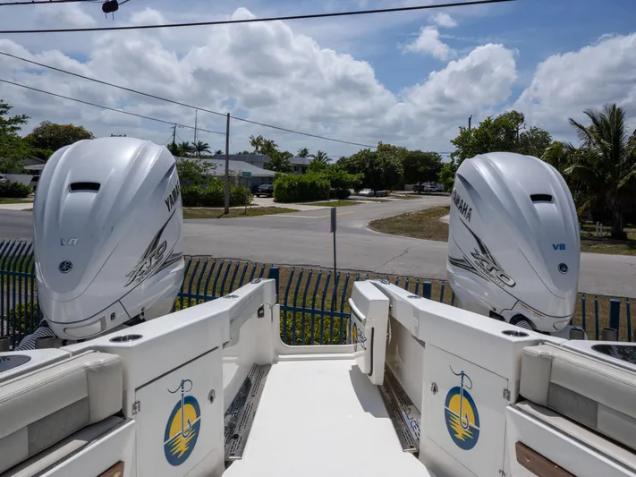  Yacht Photos Pics 2020 Solace 34 boat with twin Yamaha outboard engines, parked near a road.