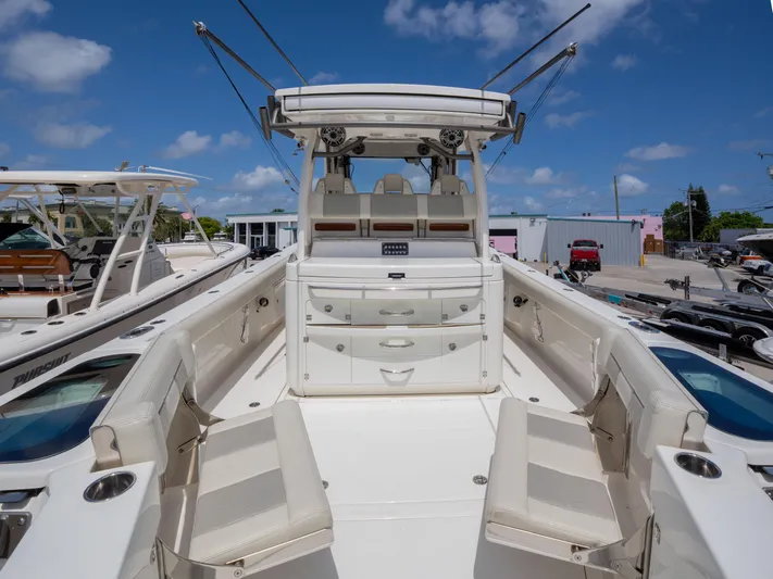  Yacht Photos Pics 2020 Solace 34 boat interior with seating and storage, under a clear blue sky.