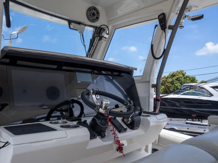  Yacht Photos Pics Interior of 2020 Solace 34 boat, featuring modern steering and navigation equipment.