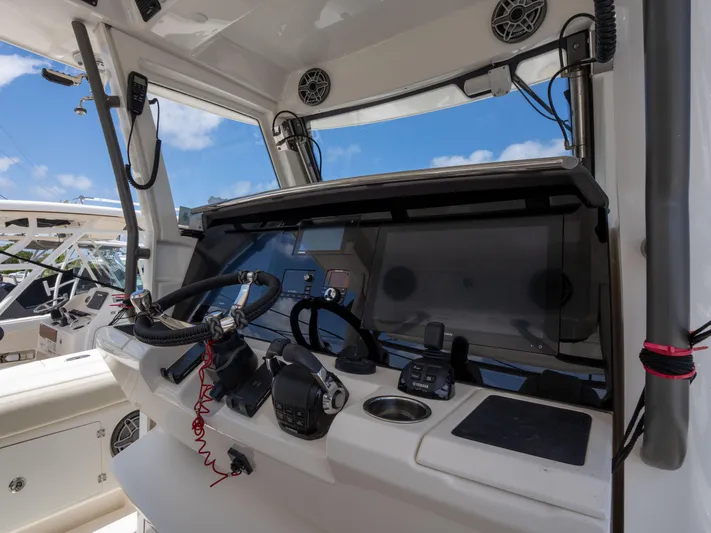  Yacht Photos Pics Cockpit of 2020 Solace 34 boat with steering wheel and navigation controls.