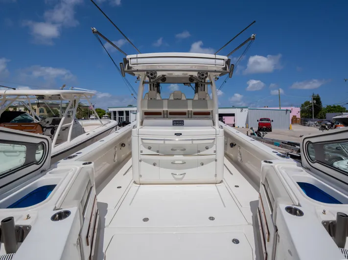  Yacht Photos Pics 2020 Solace 34 boat with spacious deck and modern design under clear blue sky.