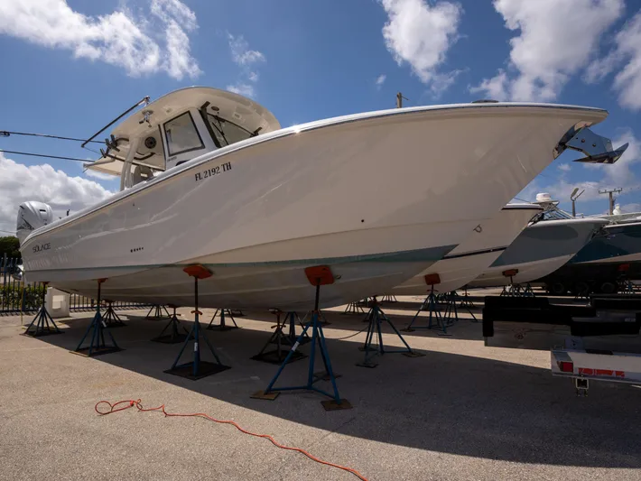  Yacht Photos Pics 2020 Solace 34 boat on stands under a blue sky.