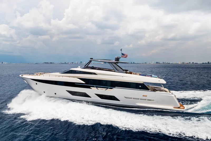 Our Trade Yacht Photos Pics Luxurious 2021 Ferretti Yachts 920 cruising on open sea under cloudy sky.