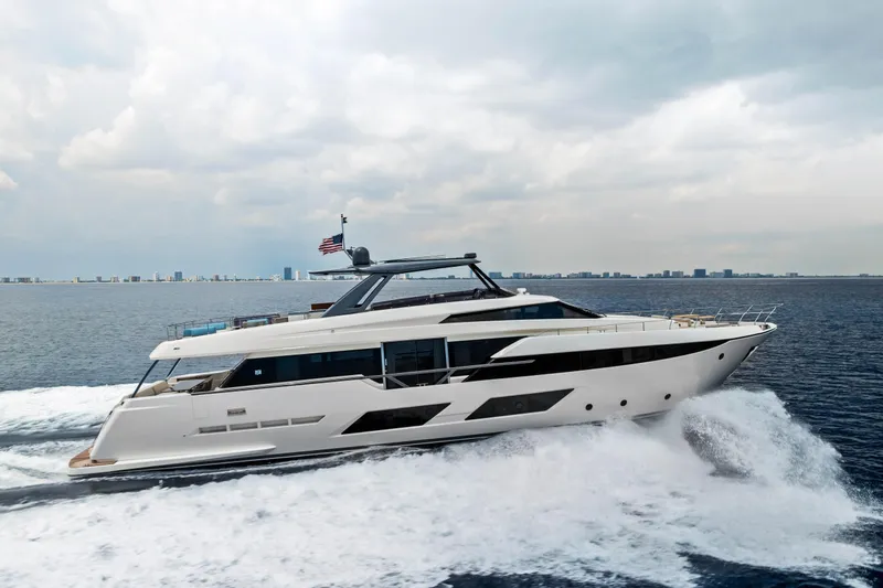 Our Trade Yacht Photos Pics 2021 Ferretti Yachts 920 cruising on open water under cloudy skies.
