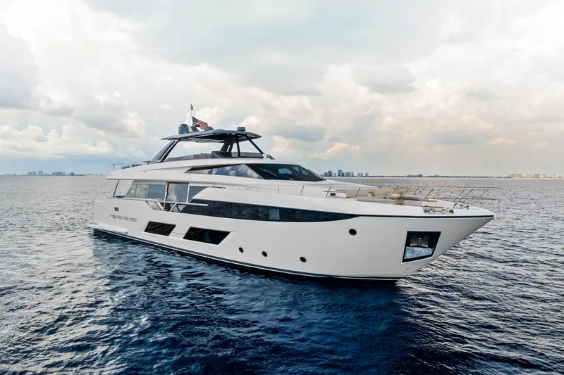 Our Trade Yacht Photos Pics 2021 Ferretti Yachts 920 cruising on open water under a cloudy sky.