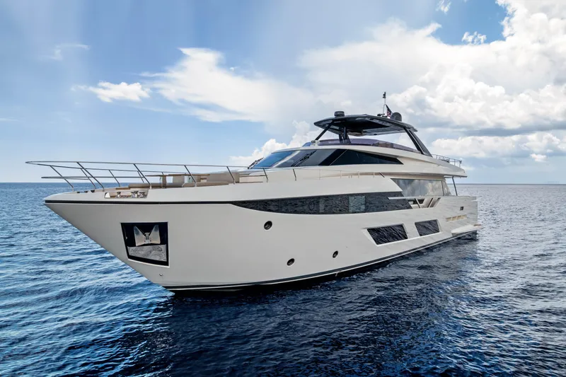 Our Trade Yacht Photos Pics Luxurious 2021 Ferretti Yachts 920 cruising on open sea under a partly cloudy sky.