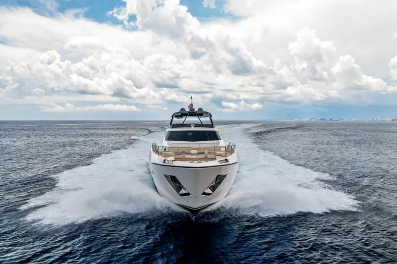 Our Trade Yacht Photos Pics 2021 Ferretti Yachts 920 cruising on open sea under cloudy sky.