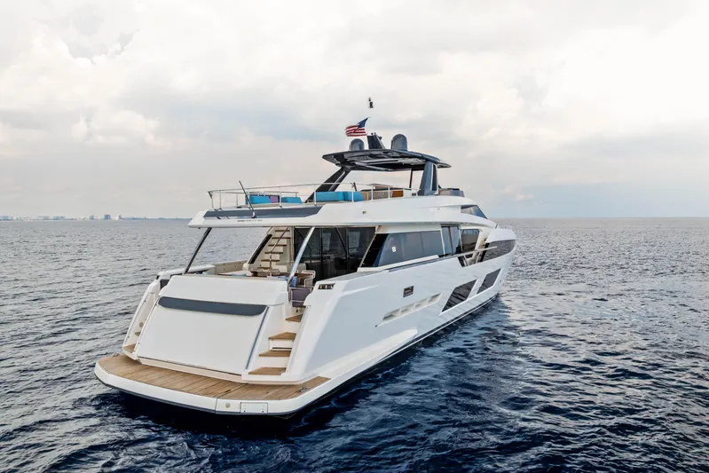 Our Trade Yacht Photos Pics Luxury 2021 Ferretti Yachts 920 cruising on open sea under cloudy sky.
