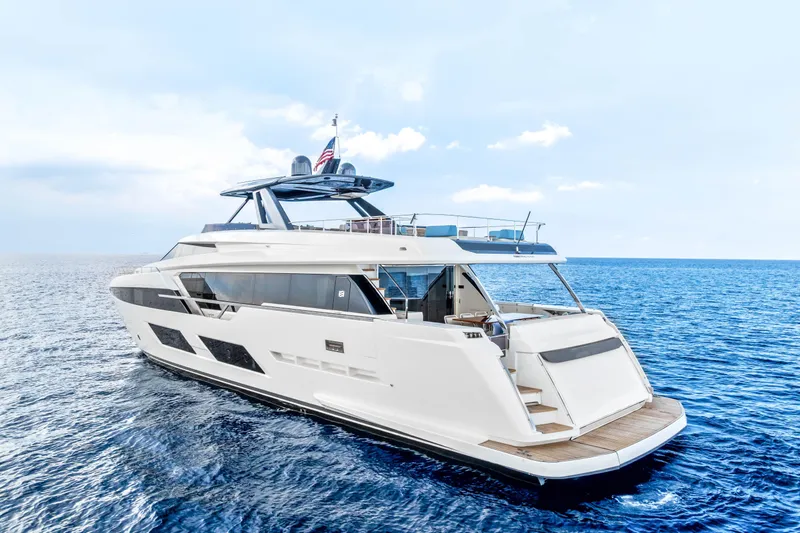 Our Trade Yacht Photos Pics Luxurious 2021 Ferretti Yachts 920 cruising on open sea under clear skies.