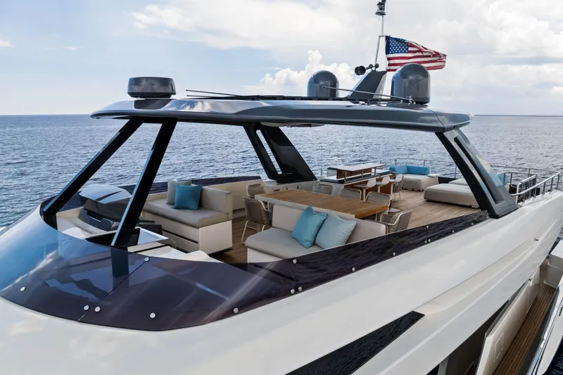 Our Trade Yacht Photos Pics Luxurious 2021 Ferretti Yachts 920 with spacious deck and elegant seating, cruising on open sea.