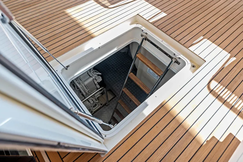 Our Trade Yacht Photos Pics Engine room access on 2021 Ferretti Yachts 920, featuring teak deck and ladder.