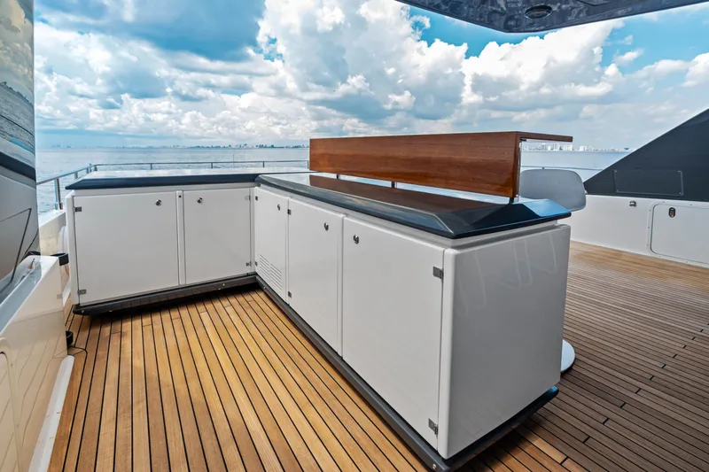 Our Trade Yacht Photos Pics Luxurious 2021 Ferretti Yachts 920 deck with sleek cabinetry and ocean view.