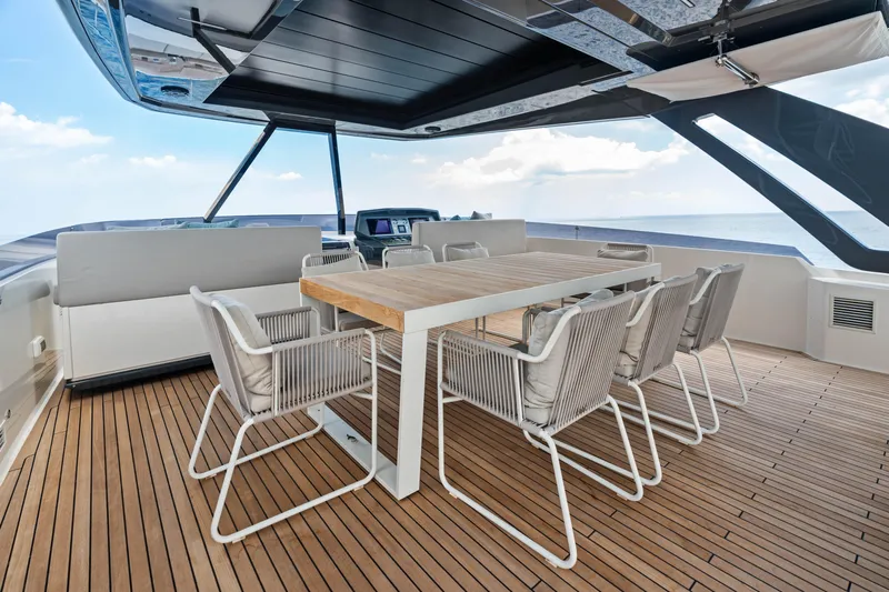 Our Trade Yacht Photos Pics Luxurious 2021 Ferretti Yachts 920 deck with elegant dining area and ocean view.