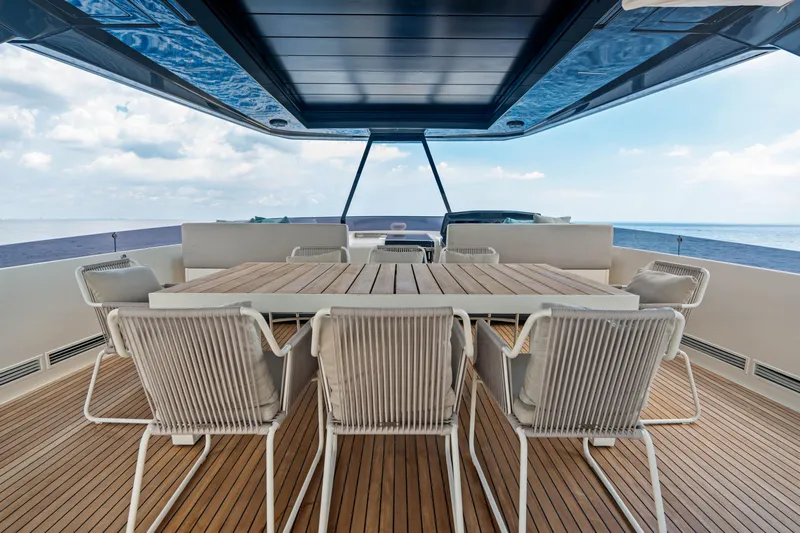 Our Trade Yacht Photos Pics Luxurious 2021 Ferretti Yachts 920 deck with elegant dining area and ocean view.