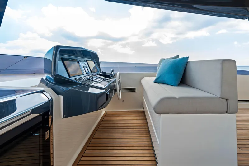 Our Trade Yacht Photos Pics Luxurious helm station on 2021 Ferretti Yachts 920 with modern controls and seating.