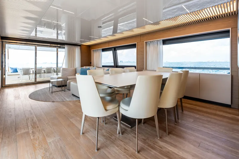 Our Trade Yacht Photos Pics Luxurious interior of 2021 Ferretti Yachts 920 with ocean view and elegant dining area.