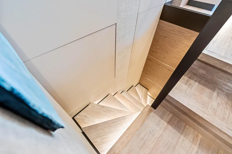 Our Trade Yacht Photos Pics Elegant wooden staircase inside 2021 Ferretti Yachts 920, showcasing modern design.