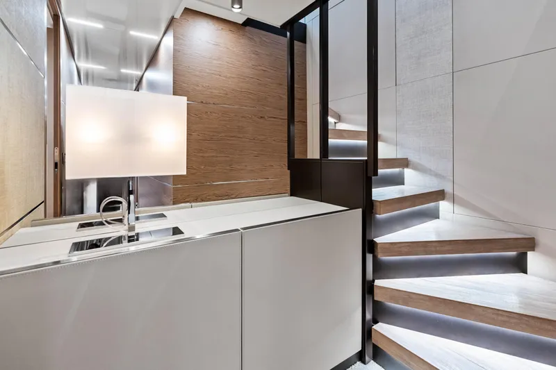 Our Trade Yacht Photos Pics Luxurious interior of 2021 Ferretti Yachts 920 with modern staircase and sleek design.