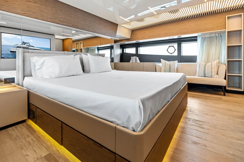 Our Trade Yacht Photos Pics Luxurious bedroom interior of 2021 Ferretti Yachts 920 with modern design and elegant furnishings.