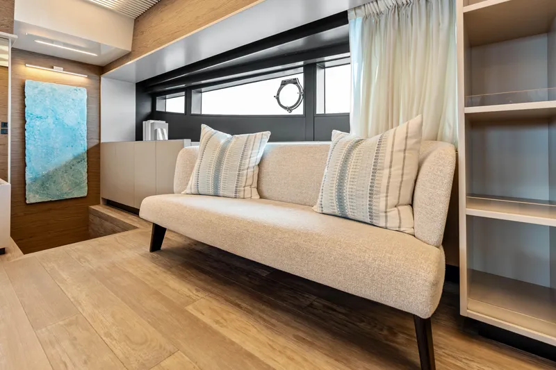 Our Trade Yacht Photos Pics Luxurious interior of 2021 Ferretti Yachts 920 with elegant sofa and modern decor.