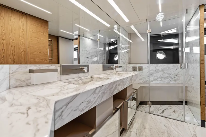 Our Trade Yacht Photos Pics Luxurious marble bathroom interior on 2021 Ferretti Yachts 920, featuring modern fixtures and elegant design.