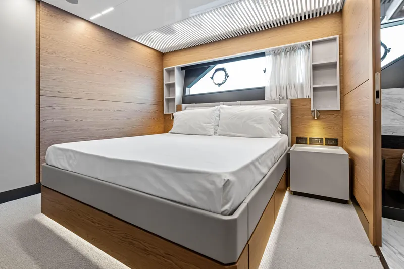 Our Trade Yacht Photos Pics Luxurious bedroom interior on 2021 Ferretti Yachts 920, featuring modern design and elegant wood finishes.