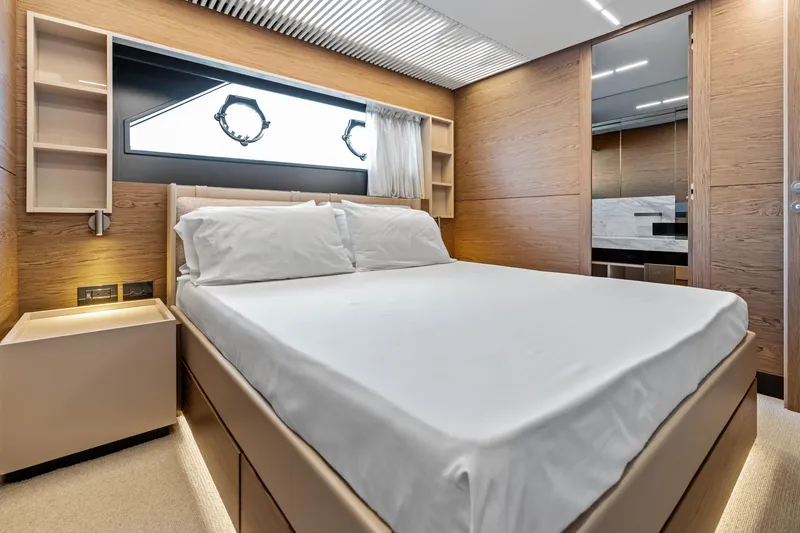 Our Trade Yacht Photos Pics Luxurious bedroom interior of 2021 Ferretti Yachts 920 with modern design and elegant furnishings.