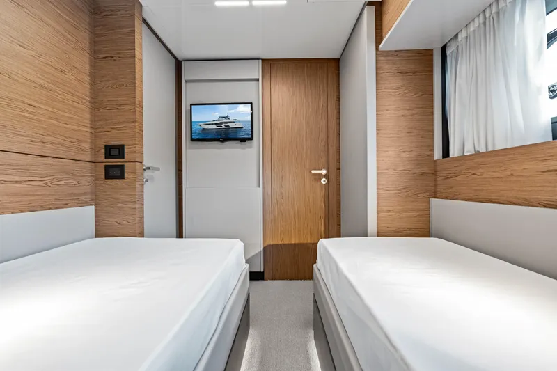 Our Trade Yacht Photos Pics Luxurious twin bedroom in 2021 Ferretti Yachts 920 with modern wood accents.