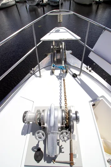 Sarita Sea Yacht Photos Pics 1983 Lancer Yachts Motorsailer bow with anchor chain and winch in marina.