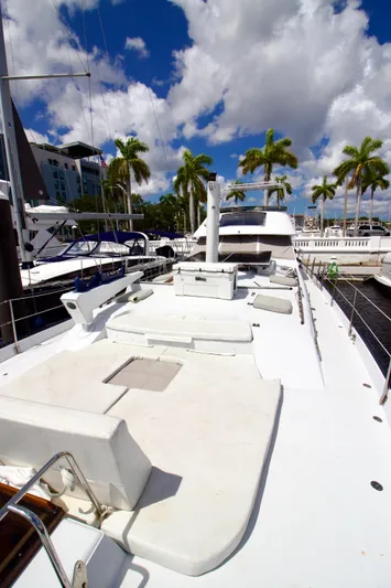 Sarita Sea Yacht Photos Pics 1983 Lancer Yachts Motorsailer docked, featuring spacious deck and clear skies.