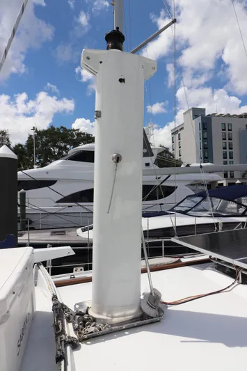 Sarita Sea Yacht Photos Pics 1983 Lancer Yachts Motorsailer mast on deck, marina background, clear sky.