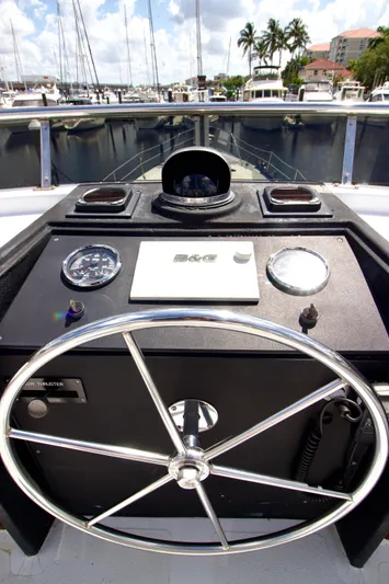 Sarita Sea Yacht Photos Pics 1983 Lancer Yachts Motorsailer helm with steering wheel and navigation instruments.