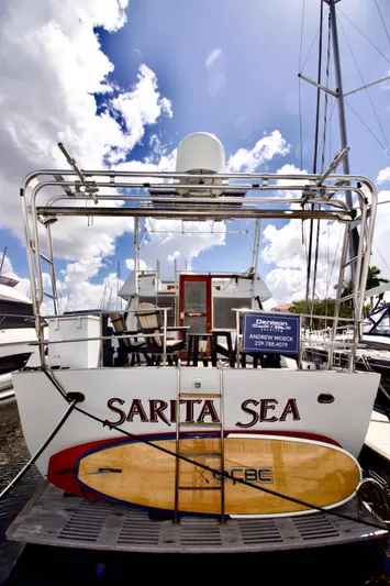 Sarita Sea Yacht Photos Pics 1983 Lancer Yachts Motorsailer "Sarita Sea" docked with surfboard on deck.