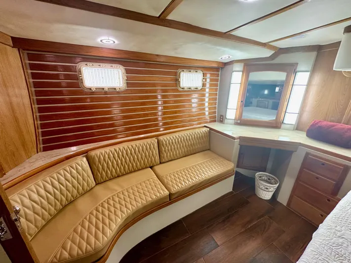 Sarita Sea Yacht Photos Pics 1983 Lancer Yachts Motorsailer interior with wood paneling and cushioned seating.